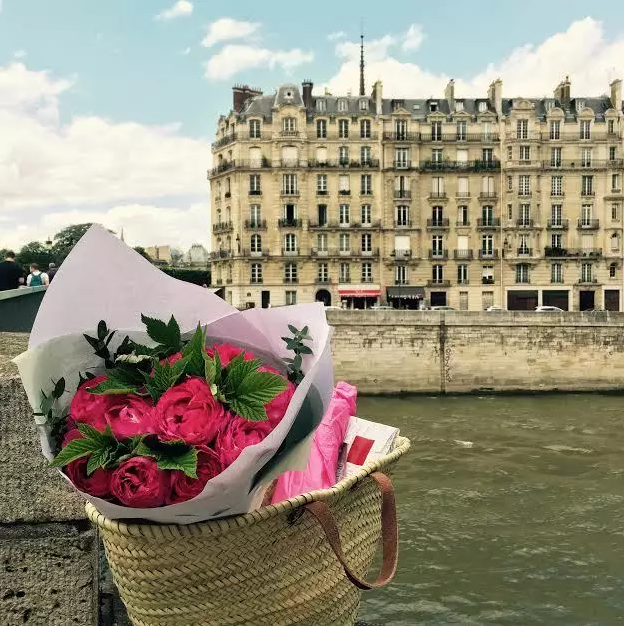 Delivering flowers and wine to guests on Ile Saint Louis.